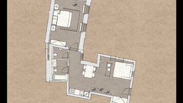 A floor plan of a hotel with two connected rooms, a kitchenette, a bathroom, and a small outdoor seating area.