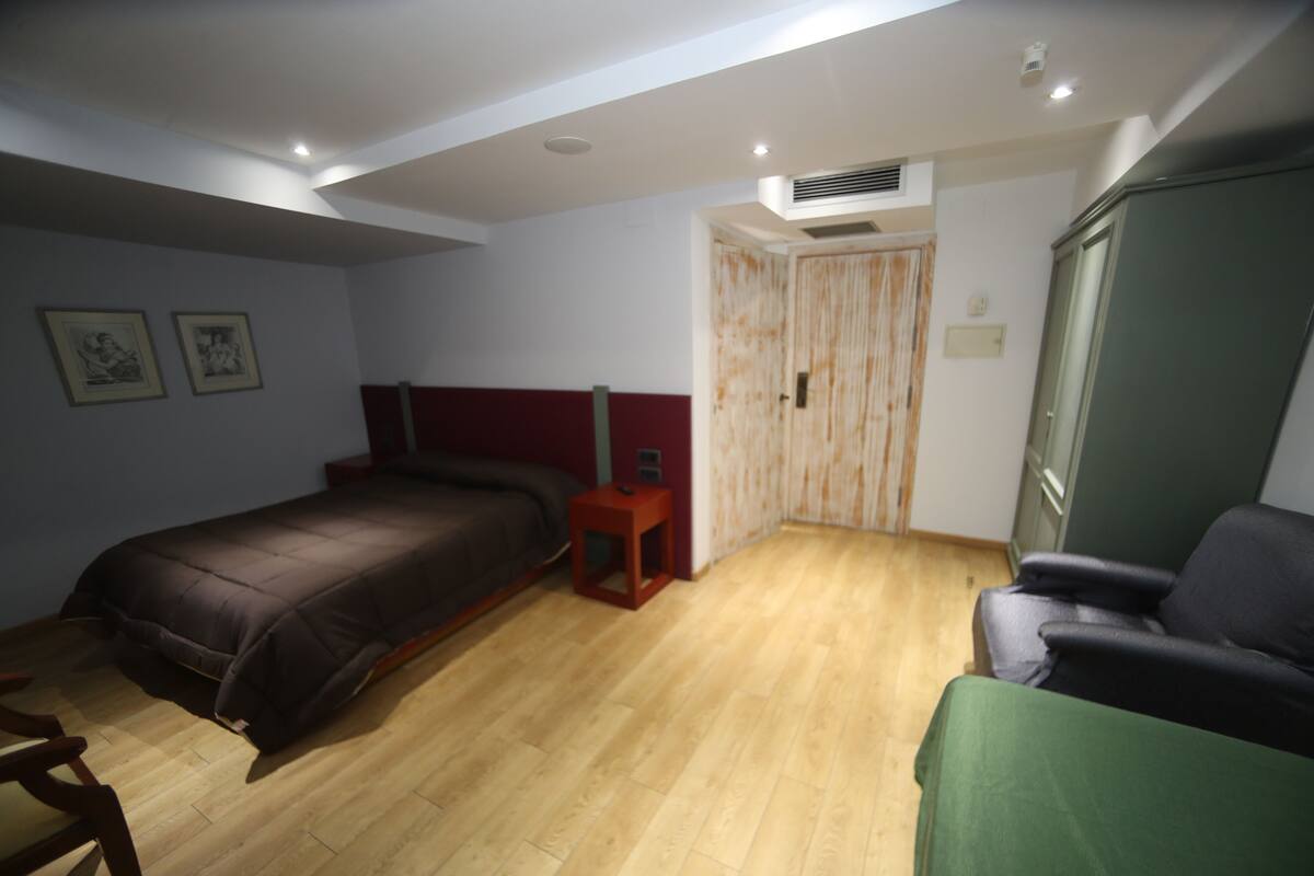 Family Quadruple Room, Balcony | In-room safe, desk, laptop workspace, soundproofing