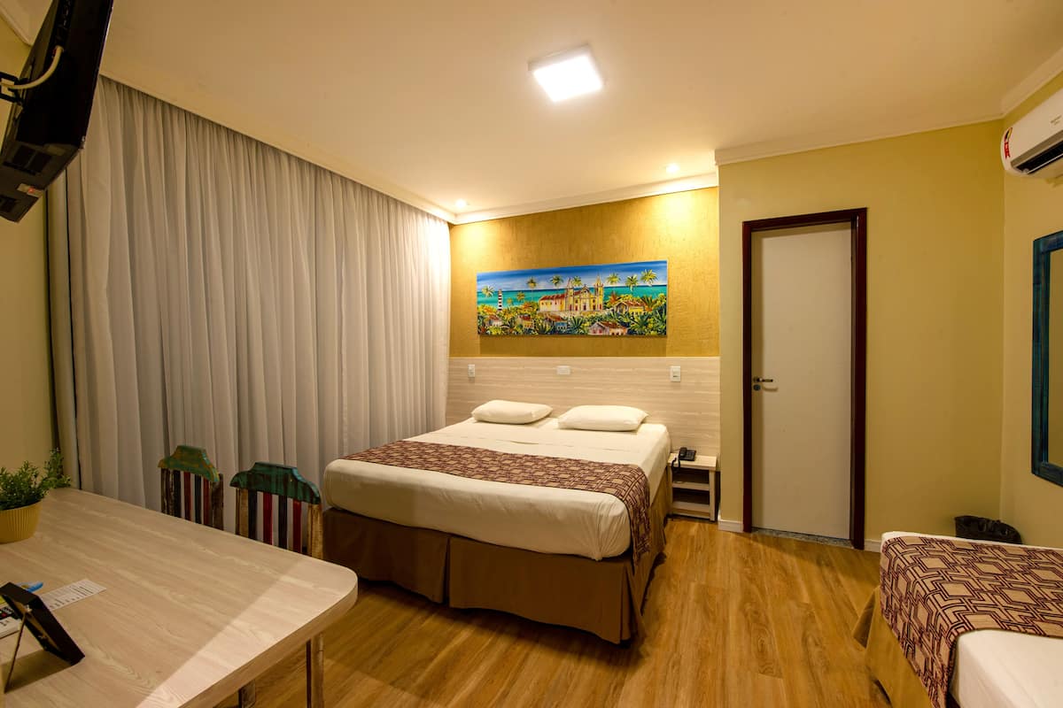 Deluxe Room, Sea View | Minibar, in-room safe, desk, free cribs/infant beds