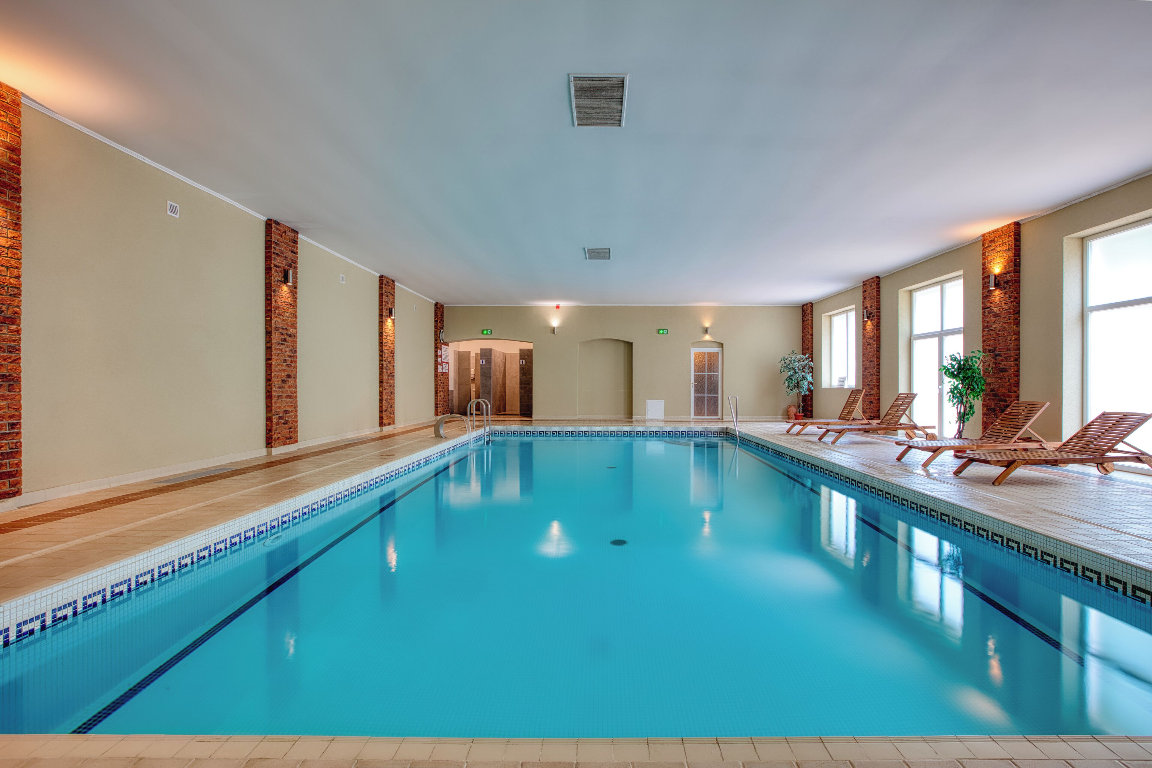Indoor pool, open 8:00 AM to 8:00 PM, pool loungers