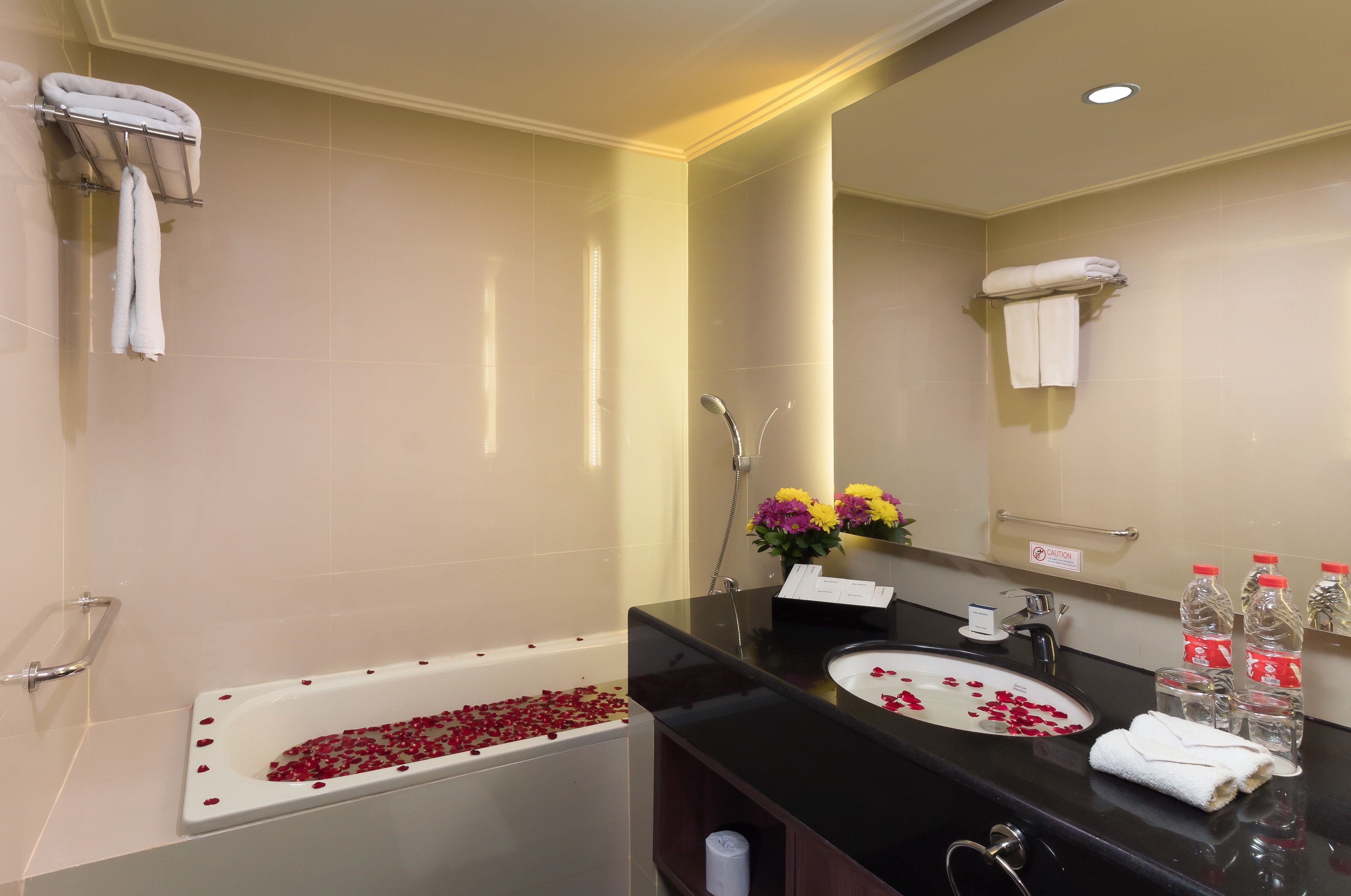 suite, 1 king bed, non smoking, city view | bathroom | shower, rainfall showerhead, hair dryer, slippers