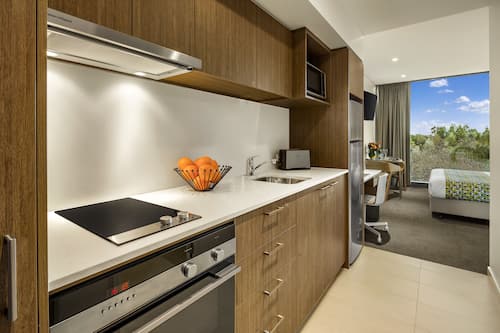 Fridge, microwave, stovetop, coffee/tea maker