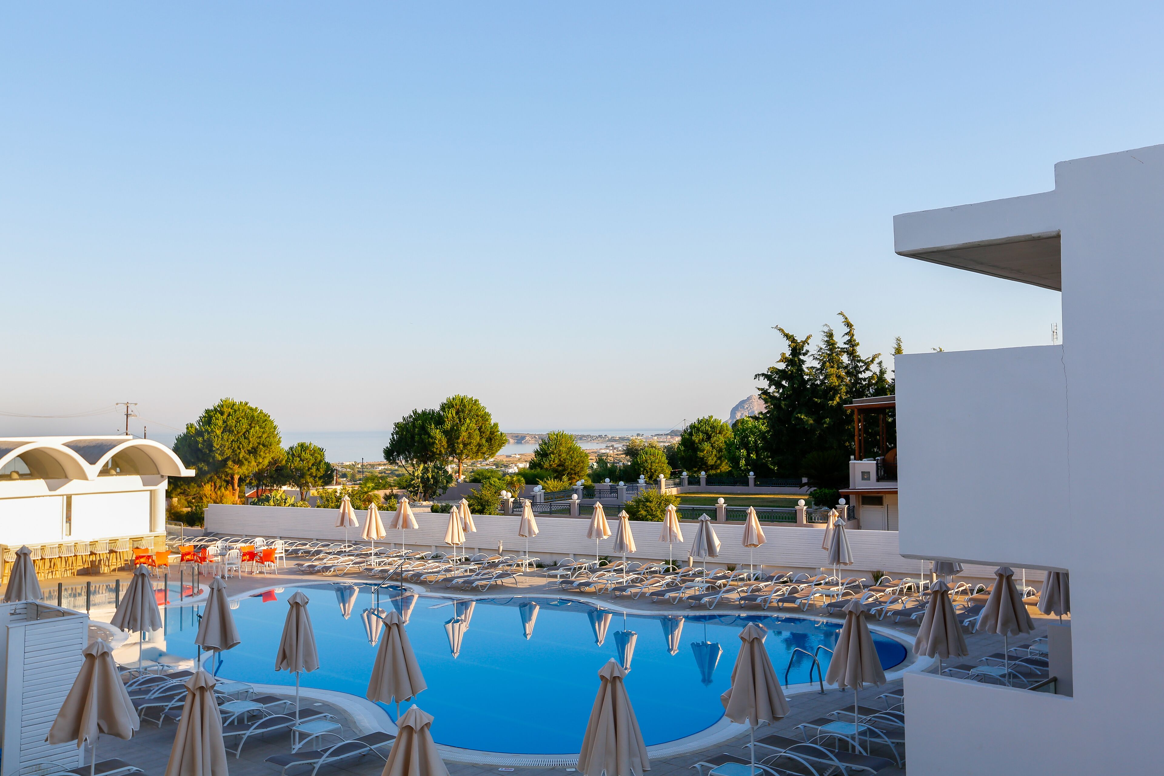 Outdoor pool, pool umbrellas, sun loungers