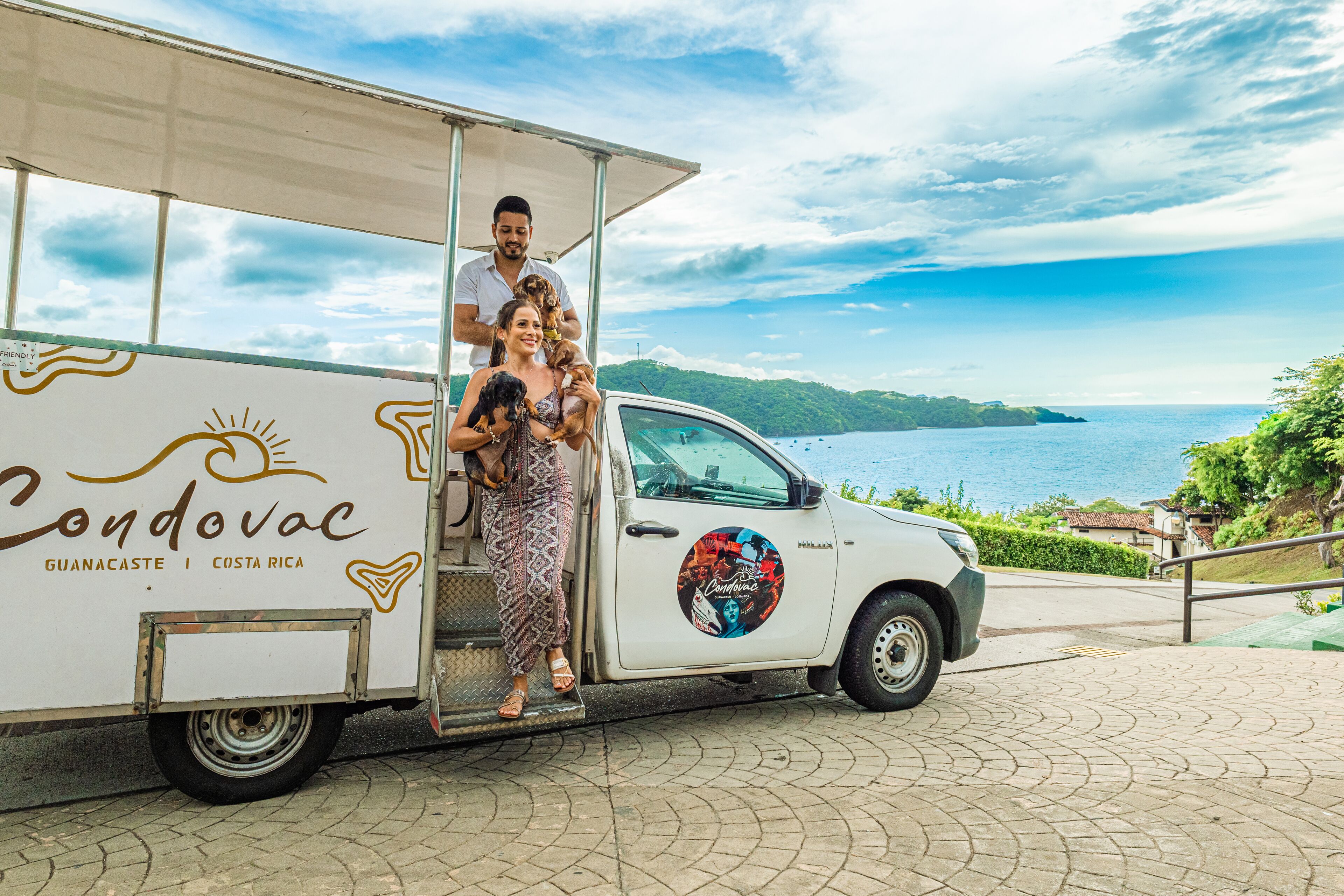 A white truck with a logo and text indicating it is a tour vehicle in Guanacaste, Costa Rica.