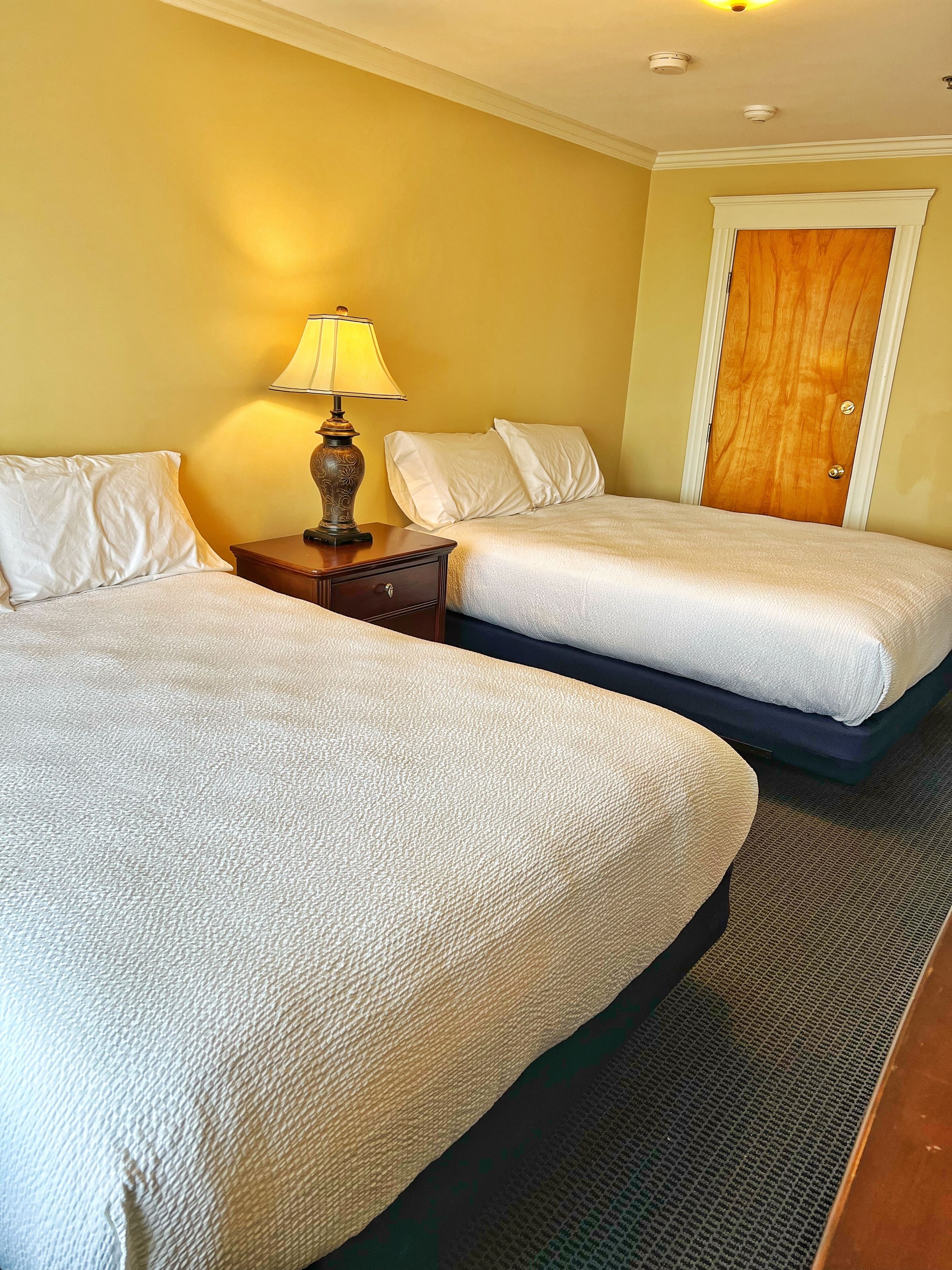 family double room, 2 queen beds, ocean view | premium bedding, in-room safe, soundproofing, iron/ironing board