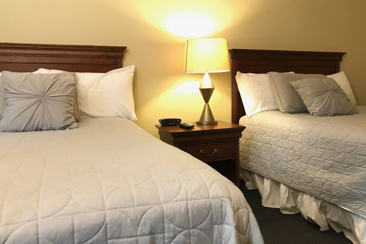 standard double room, 2 double beds, private bathroom | premium bedding, in-room safe, soundproofing, iron/ironing board