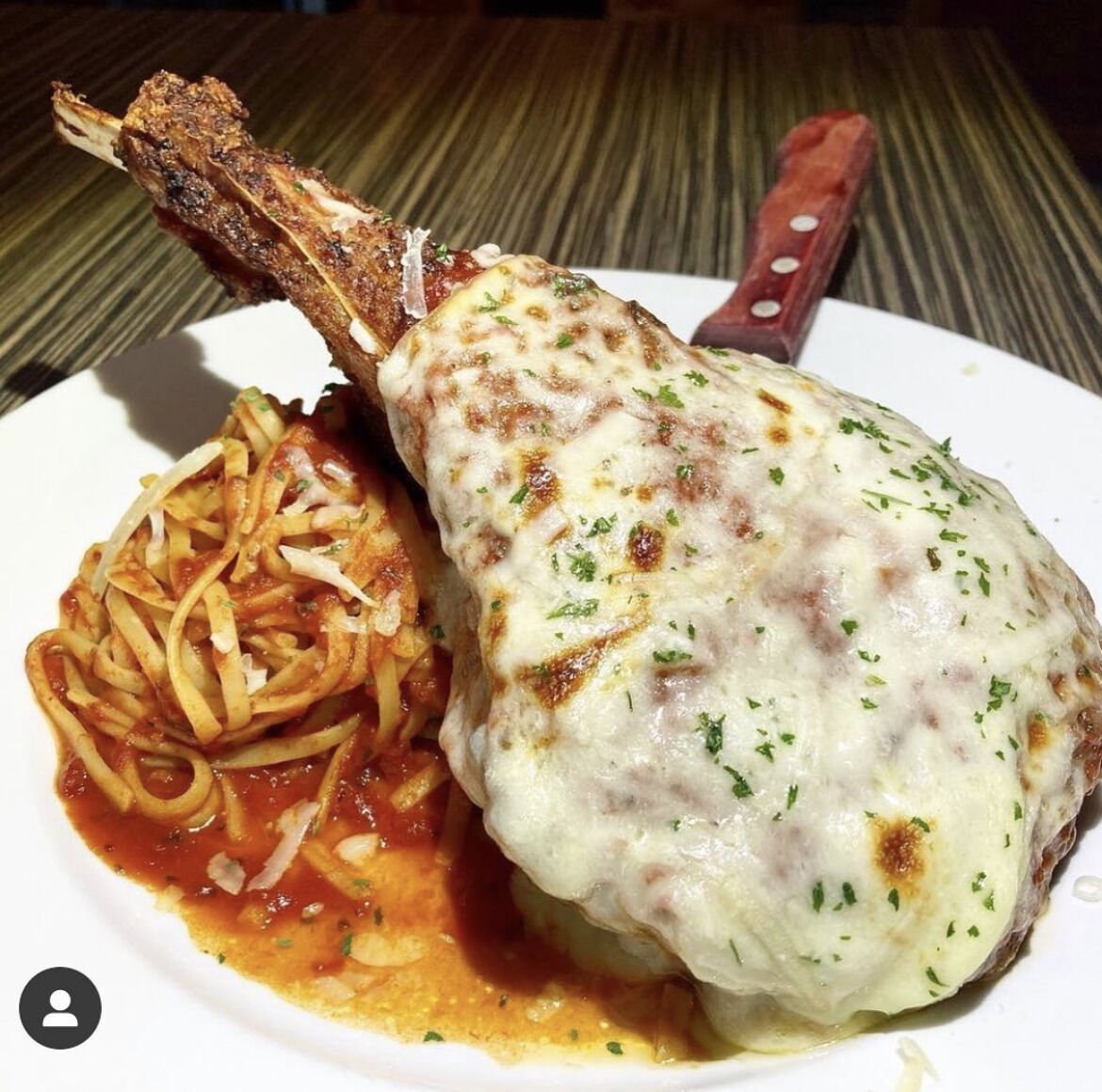 A plate with a meat dish and pasta.