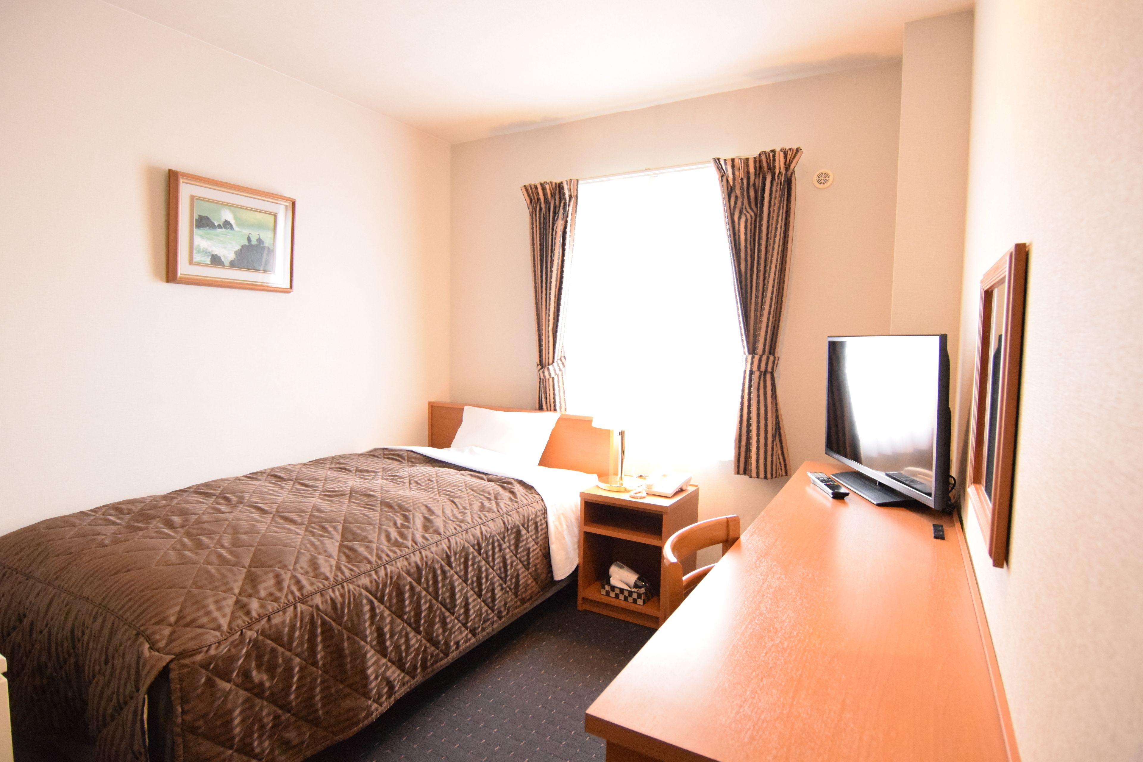 desk, blackout curtains, free wifi, bed sheets