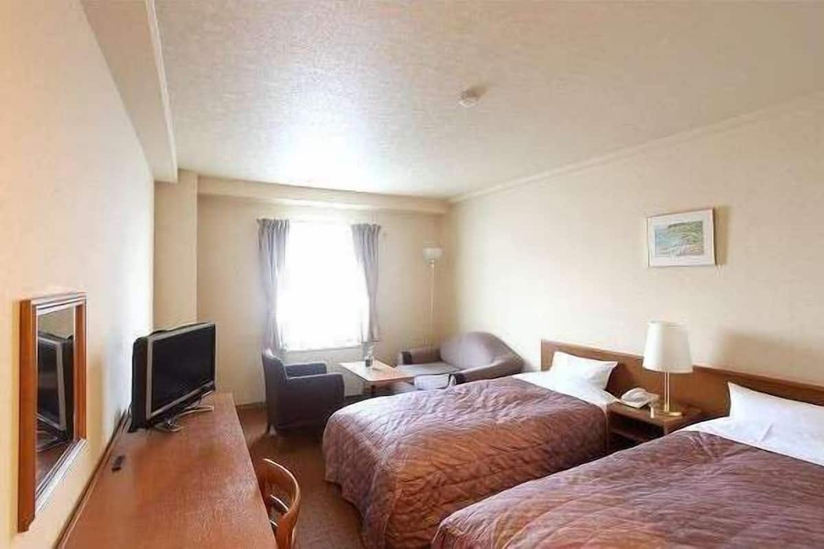 Escrivaninha, cortinas blackout, Wi-Fi de cortesia, roupa de cama