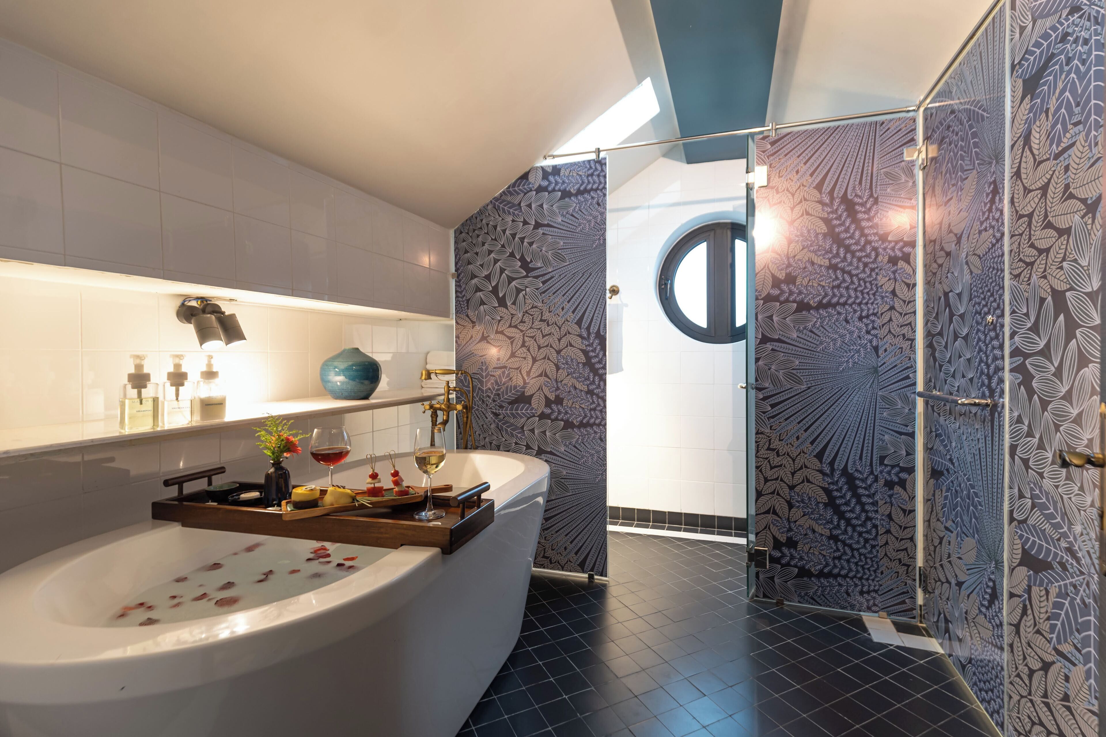 grand double room | bathroom | deep-soaking bathtub, rainfall showerhead, free toiletries, hair dryer