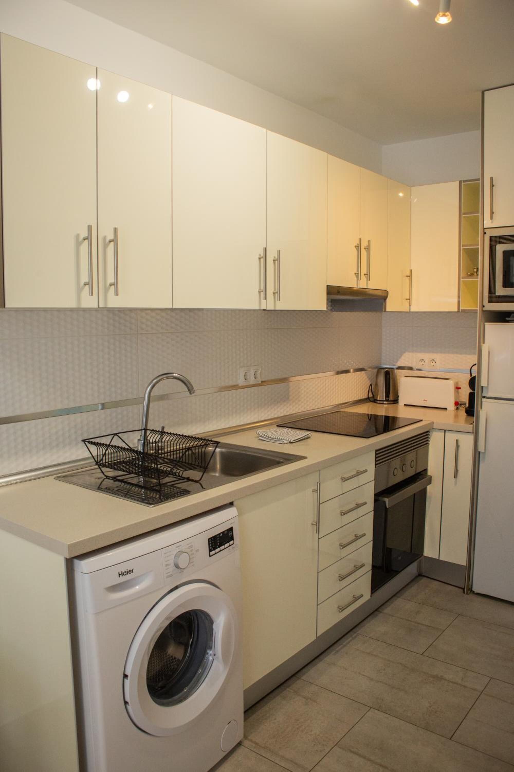 Fridge, stovetop, coffee/tea maker, cookware/dishes/utensils