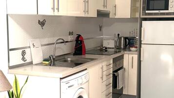 Fridge, stovetop, coffee/tea maker, cookware/dishes/utensils