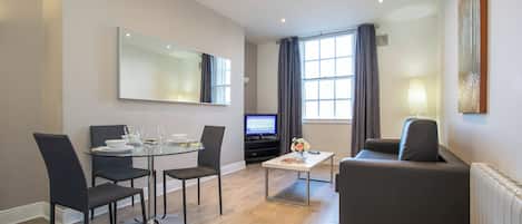 Superior Apartment, 1 Bedroom, Kitchen, River View | Living area | Flat-screen TV