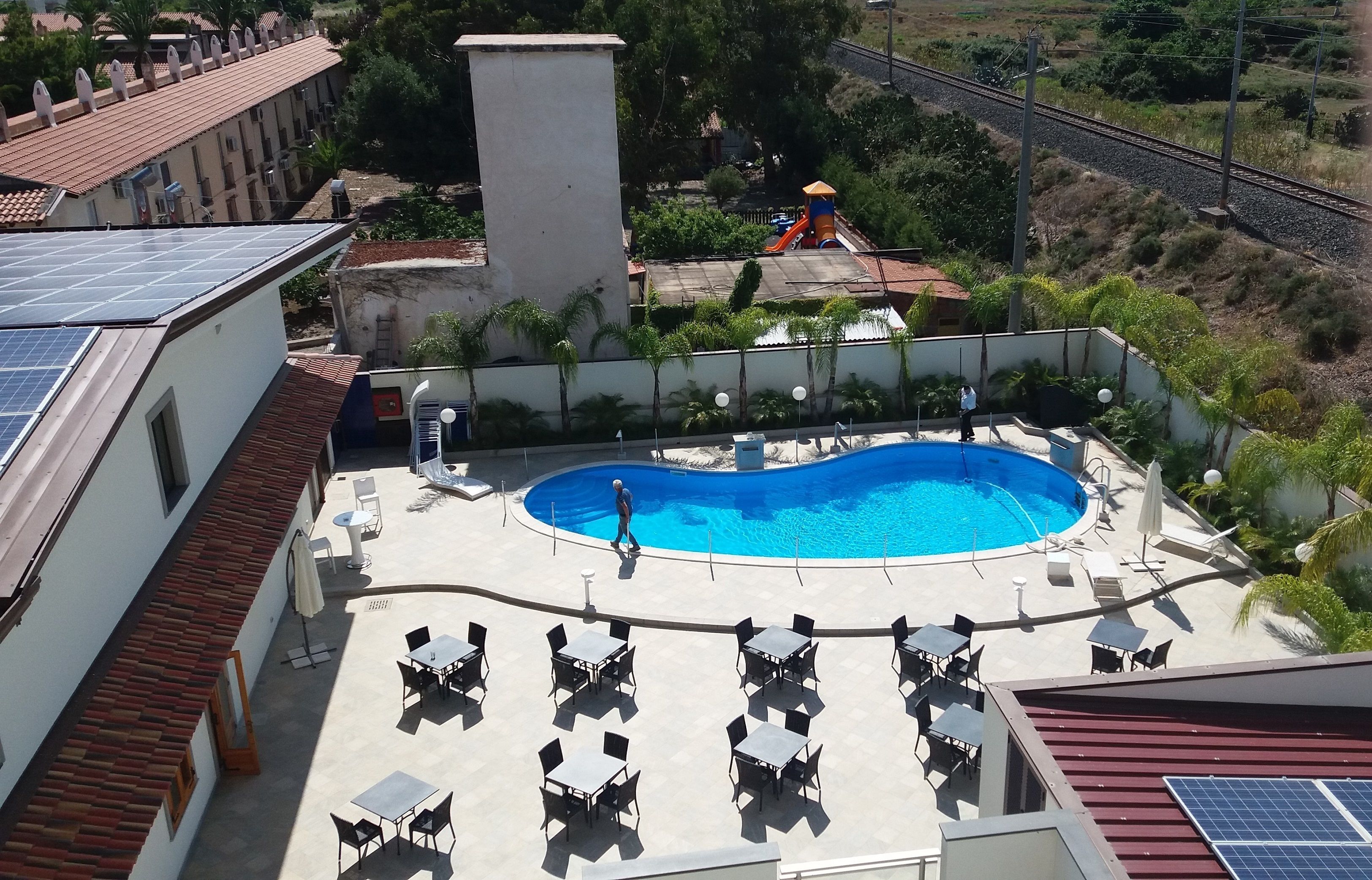 outdoor pool, open 9:00 am to 7:00 pm, pool umbrellas, pool loungers
