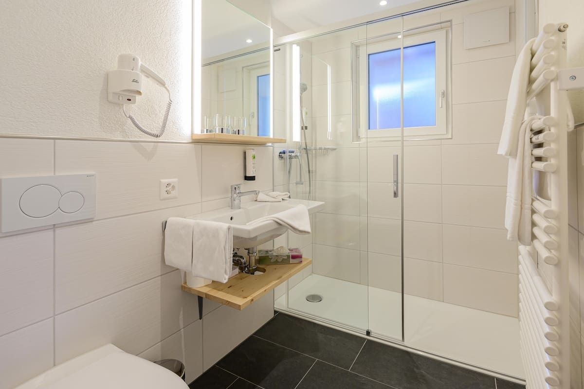 superior double room | bathroom | free toiletries, hair dryer, slippers, towels