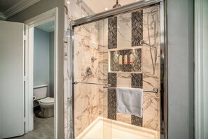 Suite, 1 King Bed with Sofa bed, Non Smoking | Bathroom | Combined shower/bathtub, free toiletries, hair dryer, towels