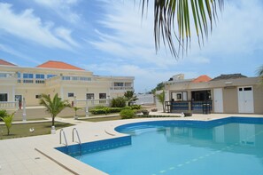 Outdoor pool, pool umbrellas, pool loungers
