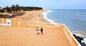 On the beach, sun loungers, beach umbrellas, beach towels