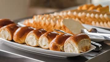 A plate of freshly baked bread rolls on a tray.