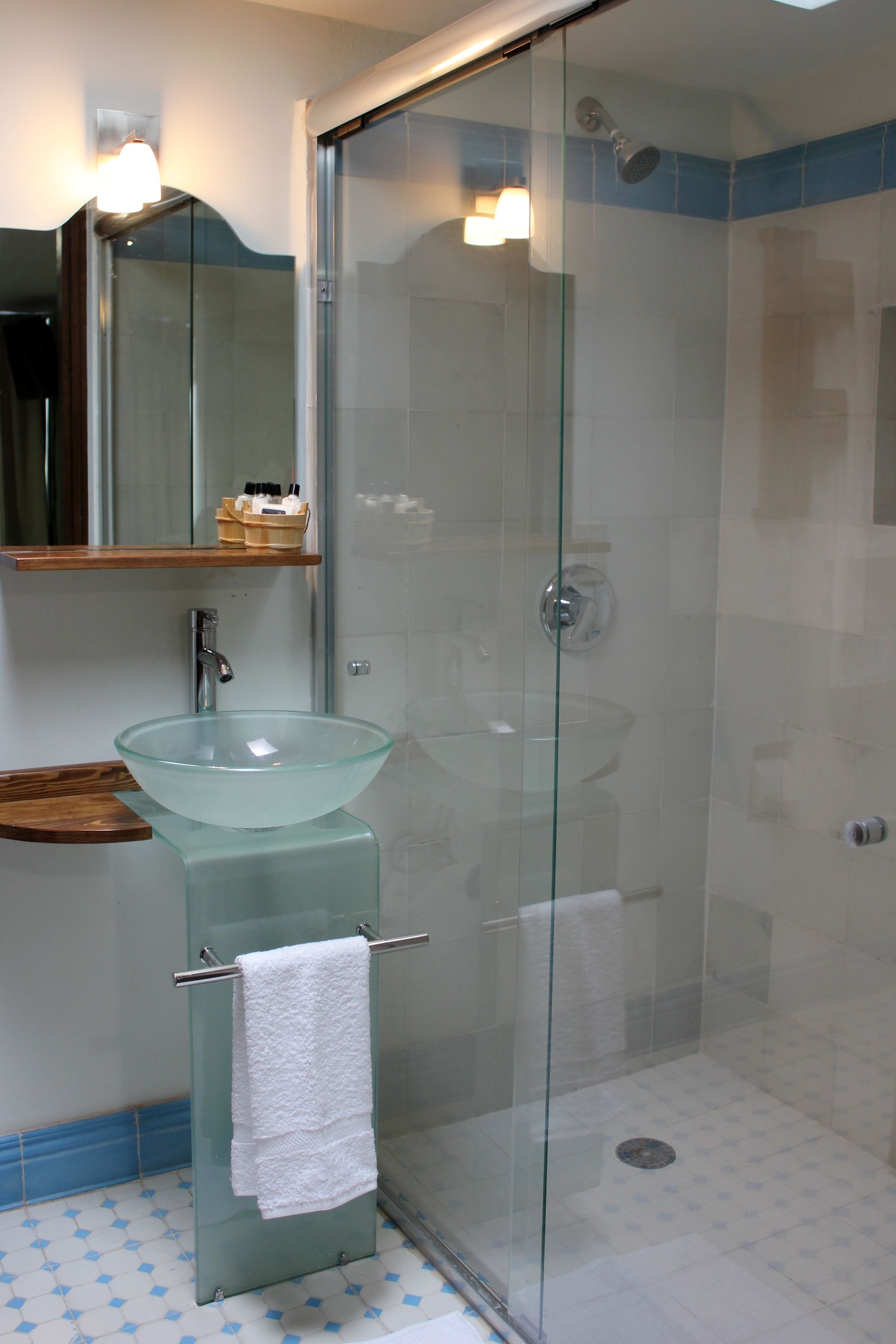 shower, designer toiletries, hair dryer, towels