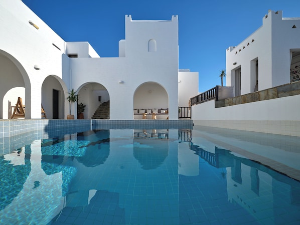 Seasonal outdoor pool, open 10:30 AM to 8:30 PM, pool umbrellas