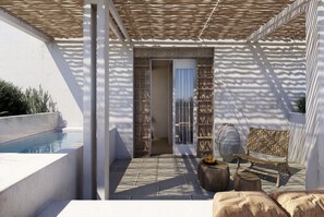 A sunlit outdoor patio with a pool, a wooden bench, and a large vase.