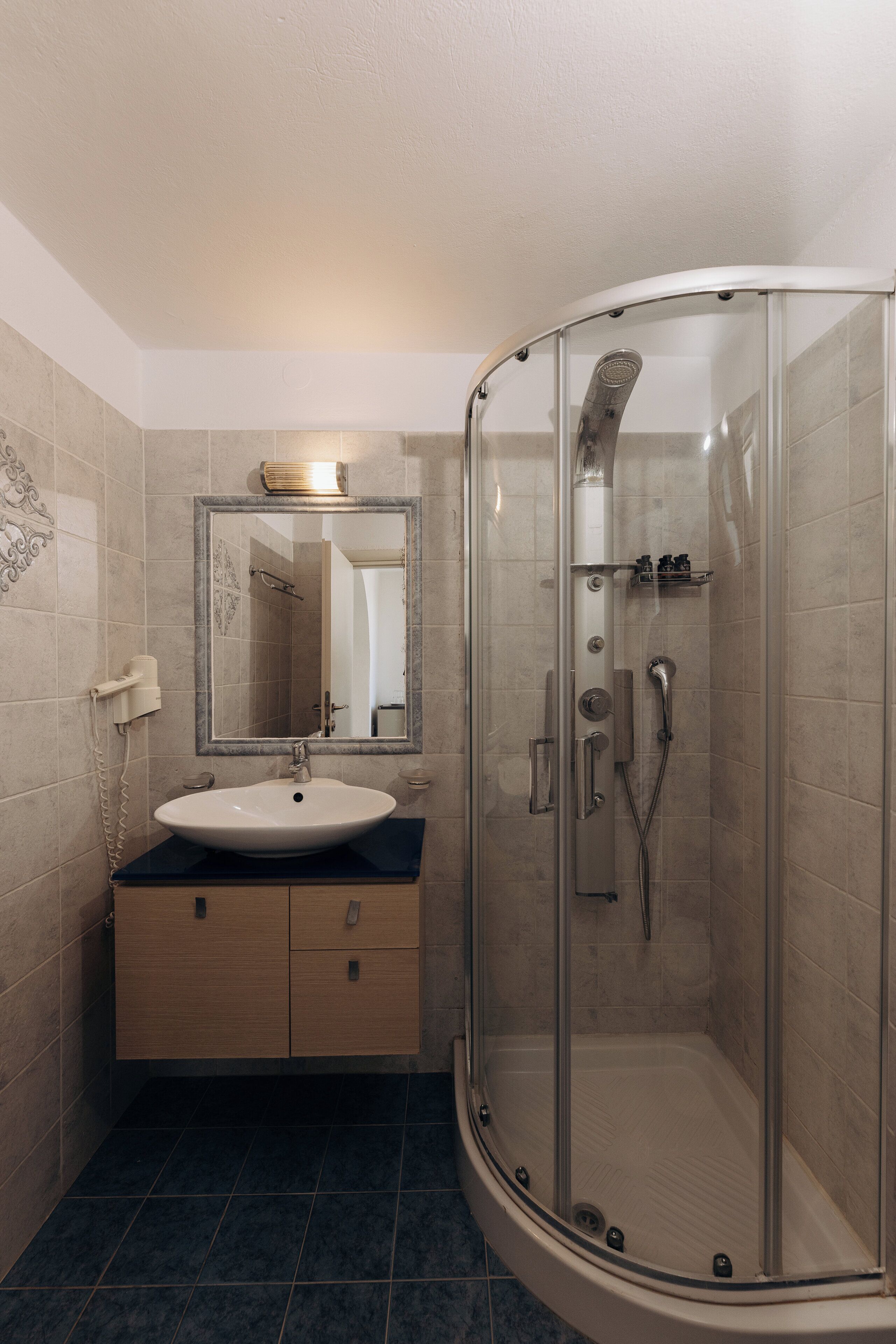 standard triple room | bathroom | shower, hair dryer, towels