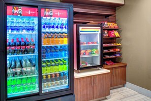 A vending machine with various beverages and snacks. - Holiday Inn Express & Suites Coldwater by IHG (Coldwater)
