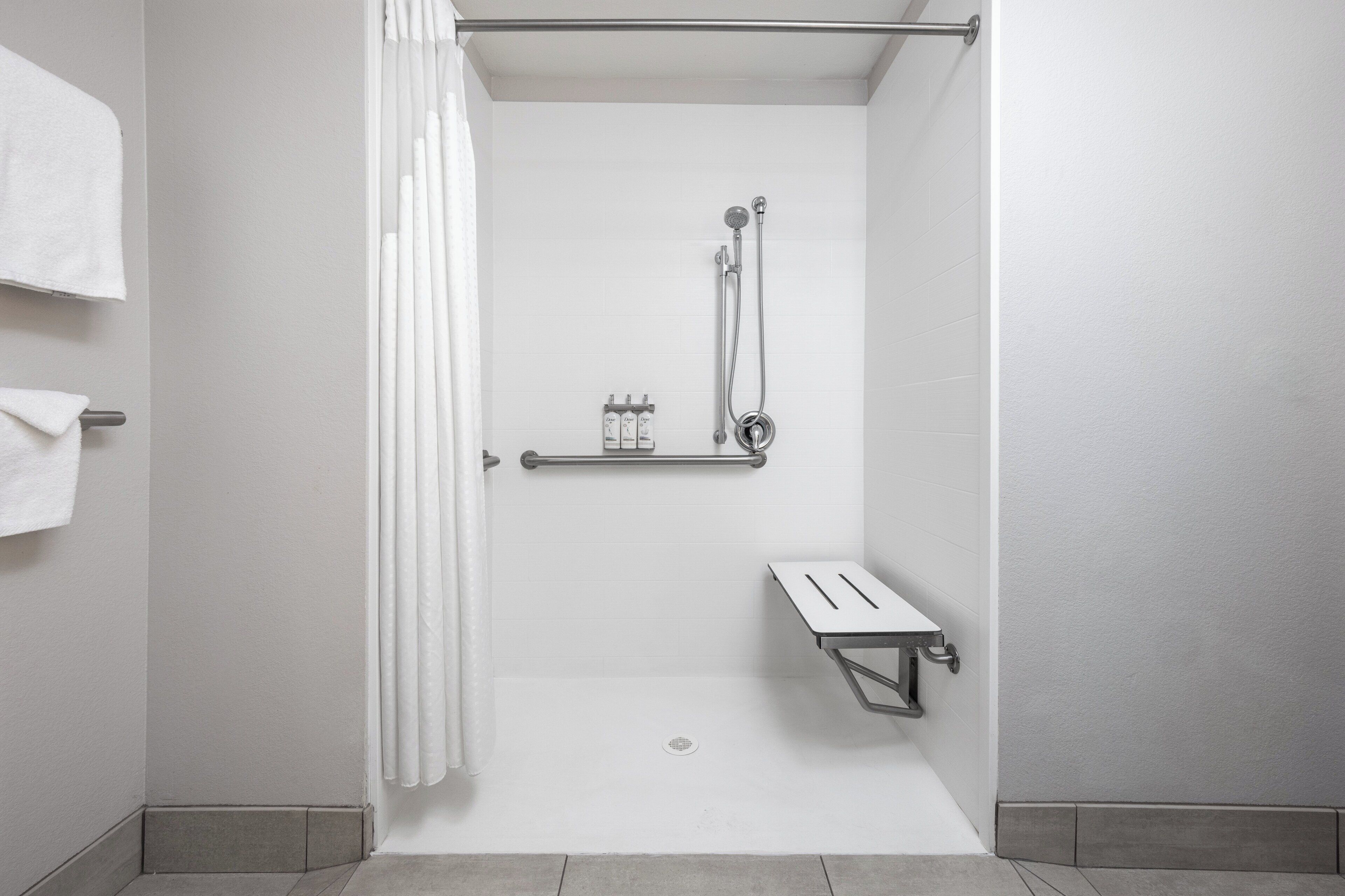 designer toiletries, hair dryer, towels, soap