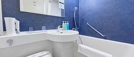 A bathroom with a white sink, mirror, and towel rack.