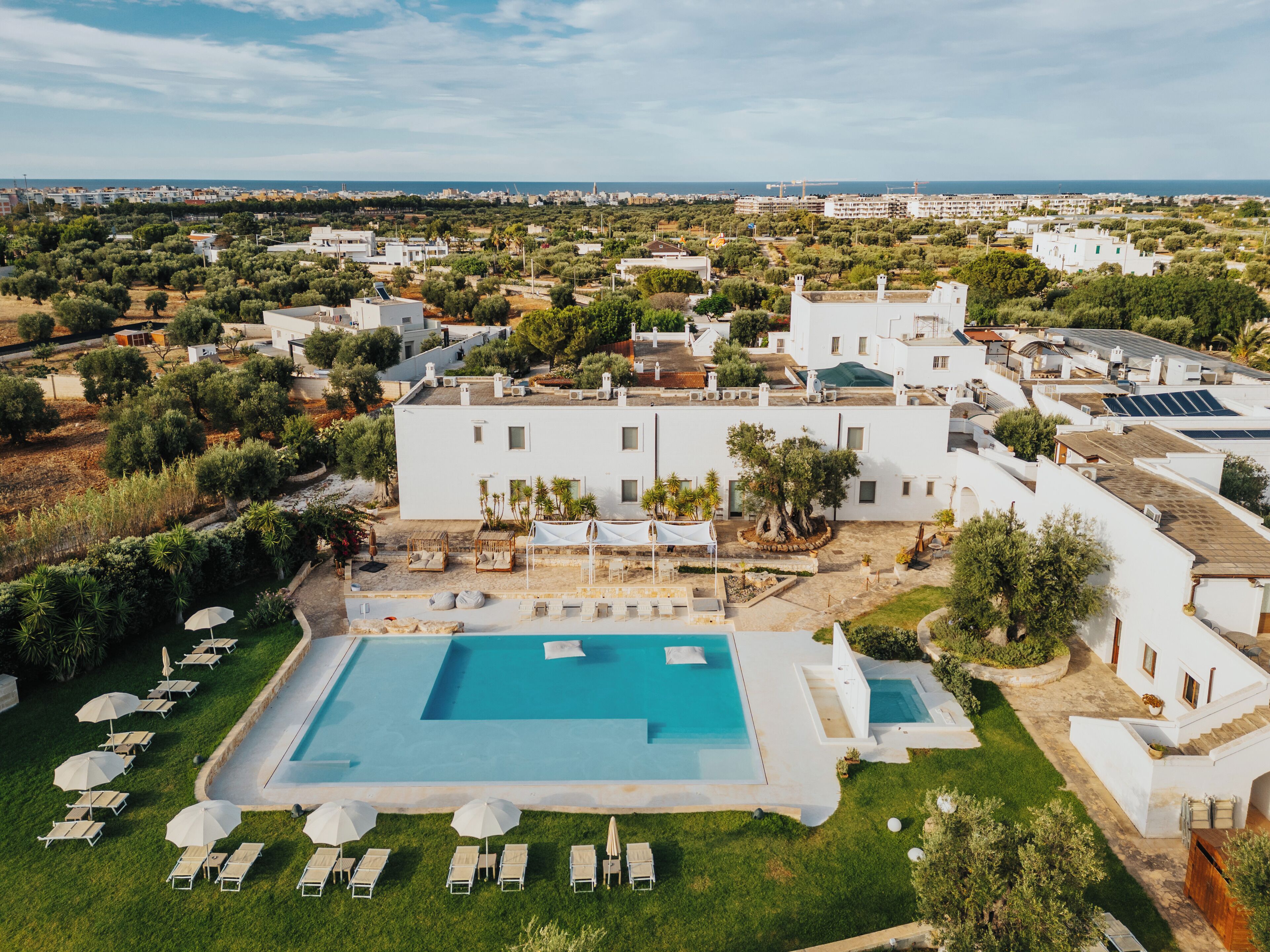 outdoor pool, pool umbrellas, pool loungers