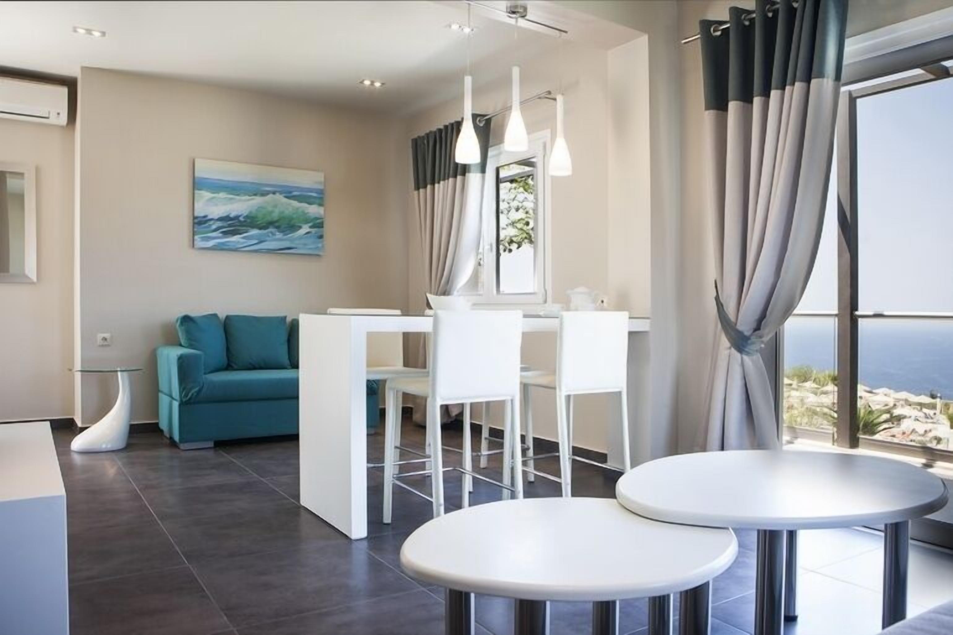 Junior Suite, Sea View | Living area | TV