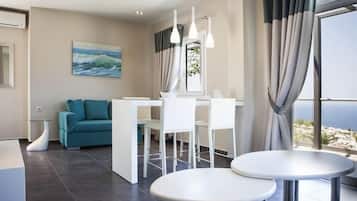 Junior Suite, Sea View | Living area | TV