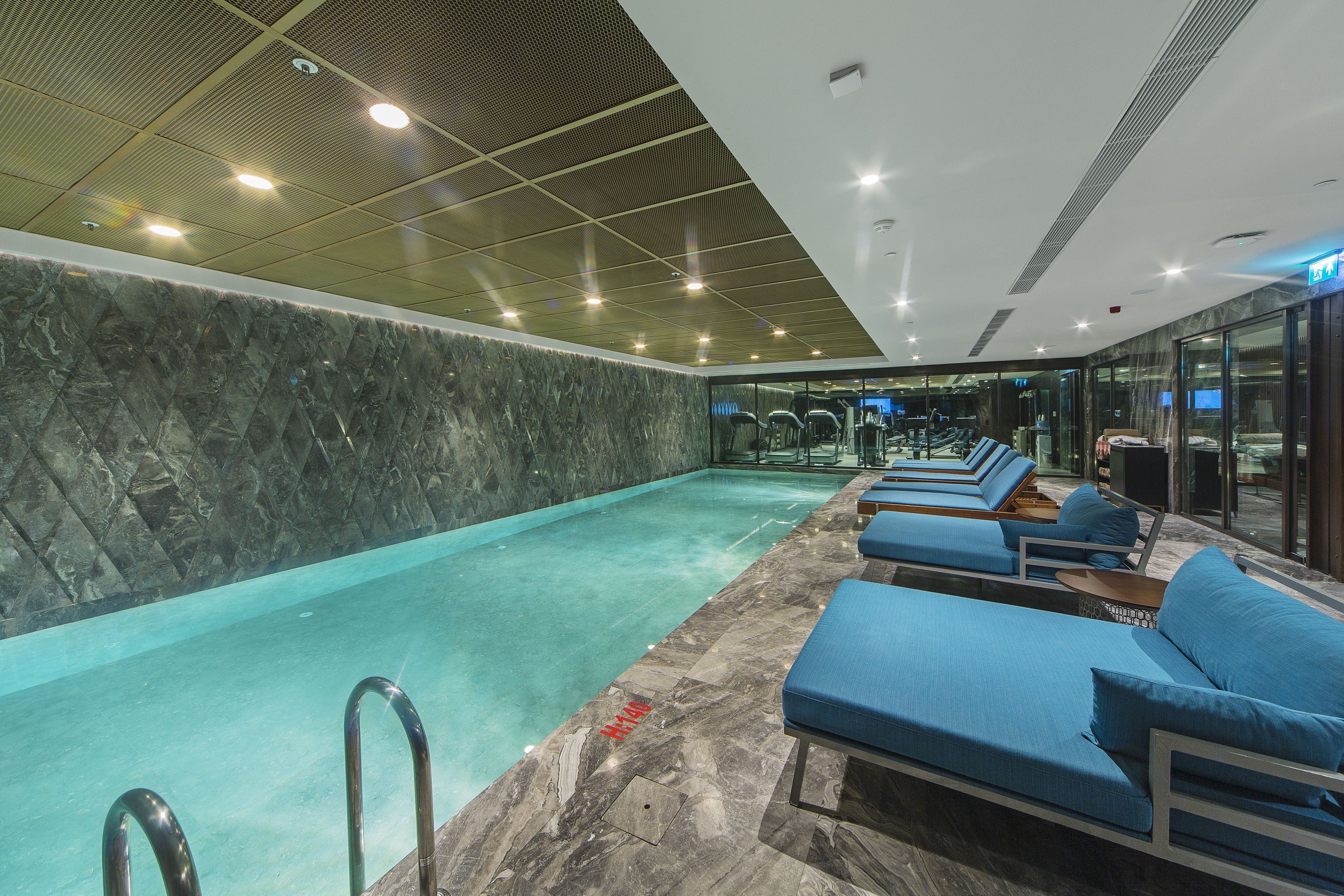 Indoor pool, open 7:00 AM to 11:00 PM, pool loungers