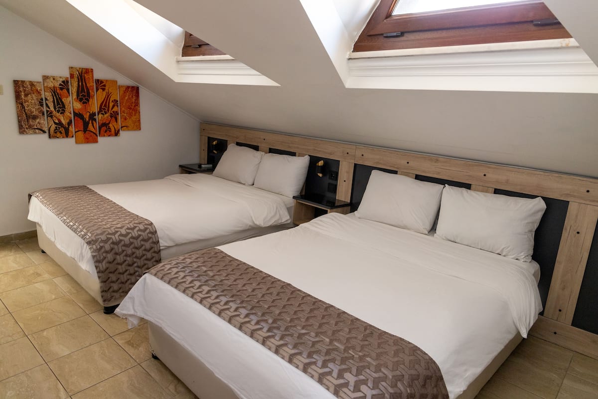 Economy Quadruple Room | Egyptian cotton sheets, premium bedding, memory foam beds, free minibar