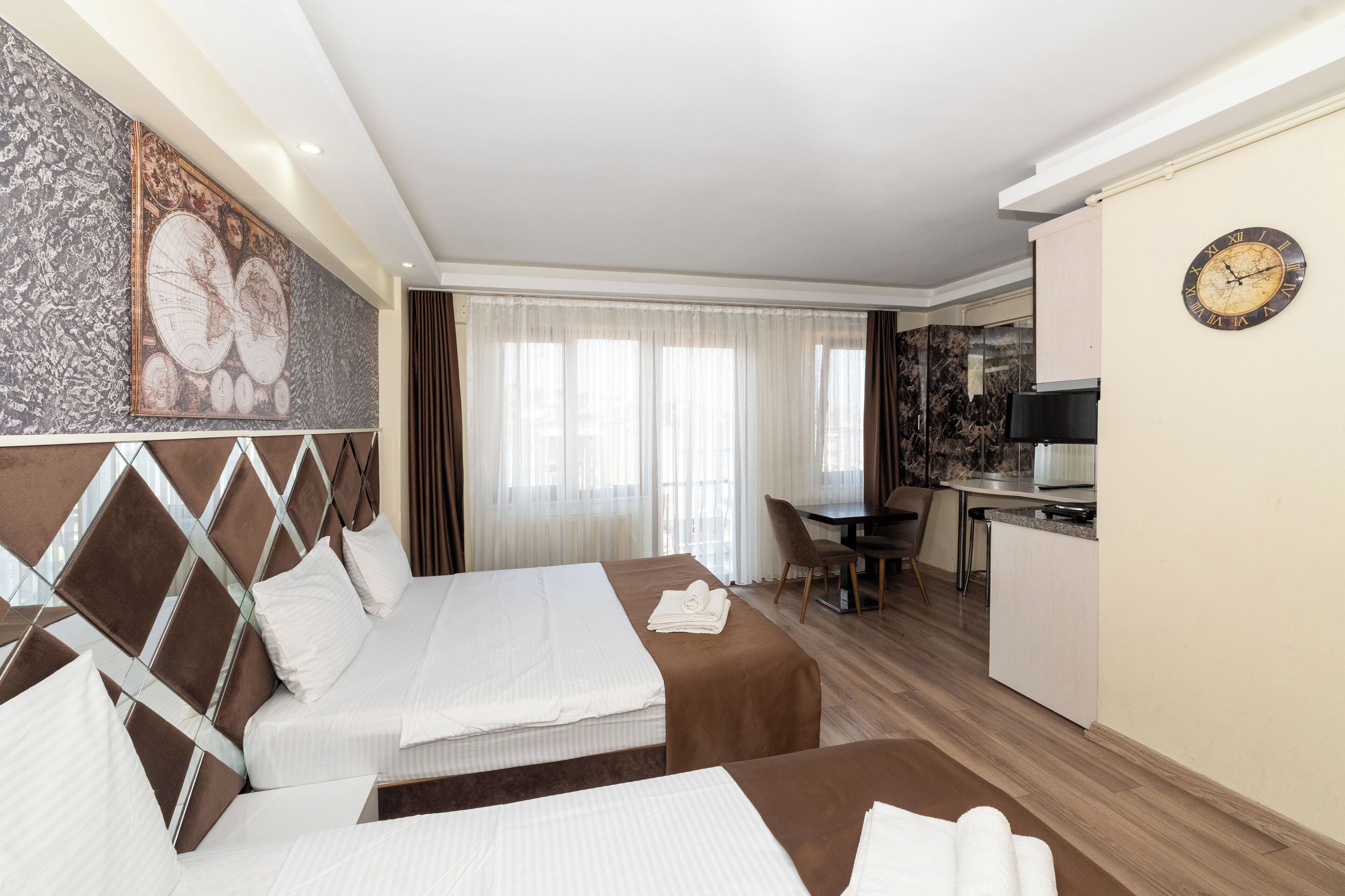Triple Room, Kitchen, City View | Frette Italian sheets, premium bedding, down comforters, in-room safe