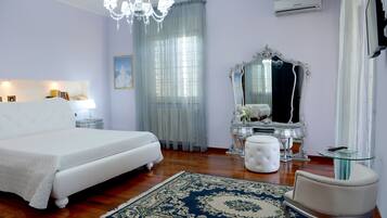 Deluxe Suite, 1 King Bed, Ensuite, Pool View | Premium bedding, minibar, individually decorated, soundproofing