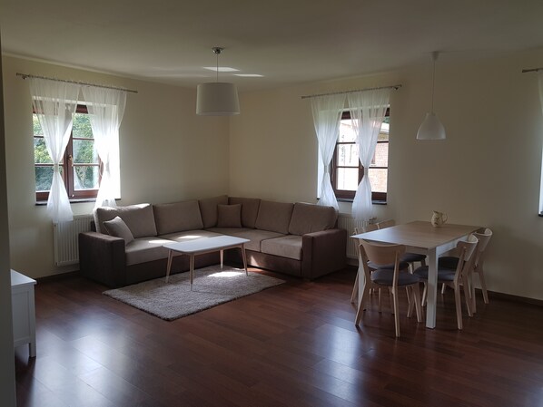 Deluxe Apartment, 1 Bedroom, Kitchenette | Living area | TV