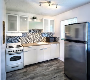 Full-sized fridge, microwave, stovetop, coffee/tea maker - Park Shore Suites St Pete Beach (St. Pete Beach)