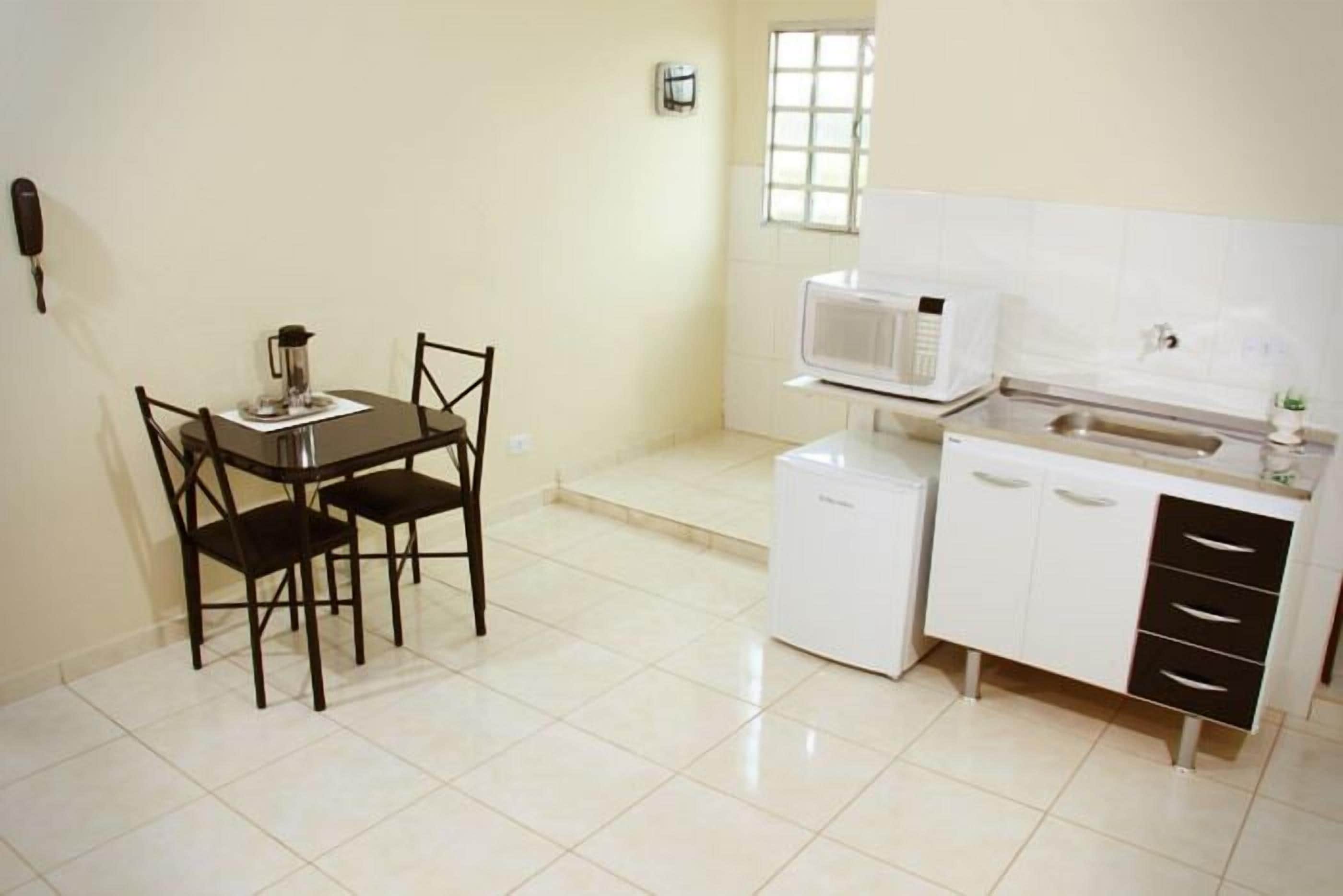 Mini-fridge, microwave, cookware/dishes/utensils