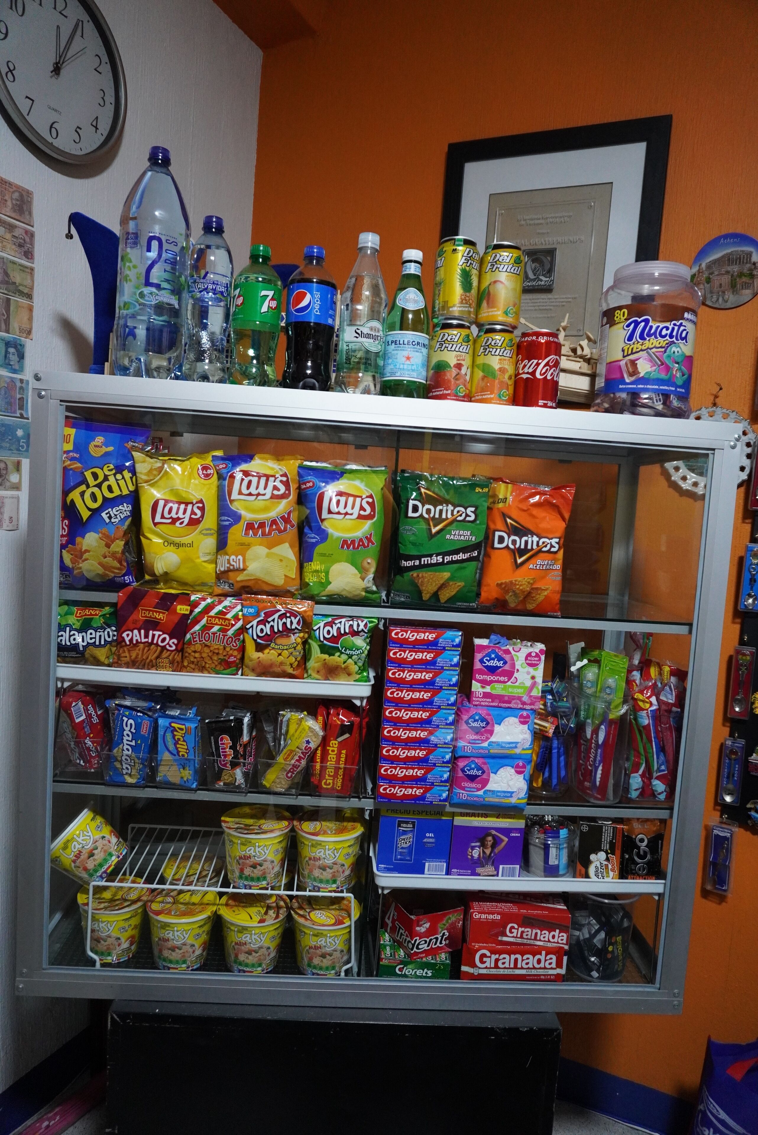 A vending machine stocked with snacks, drinks, and personal care items.