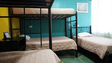 Desk, laptop workspace, bed sheets