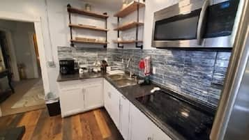 Standard Studio Suite | Private kitchen | Full-size fridge, microwave, stovetop, dishwasher