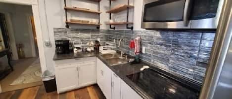 Standard Studio Suite | Private kitchen | Full-size fridge, microwave, stovetop, dishwasher