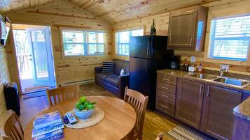 Deluxe Cabin, River View | Living area | 50-inch LED TV with digital channels, TV, streaming services