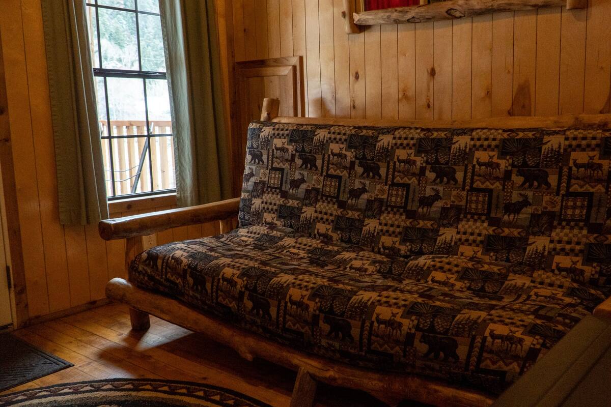 deluxe riverfront cabin "imogene" | living area | 50-inch led tv with digital channels, tv, streaming services