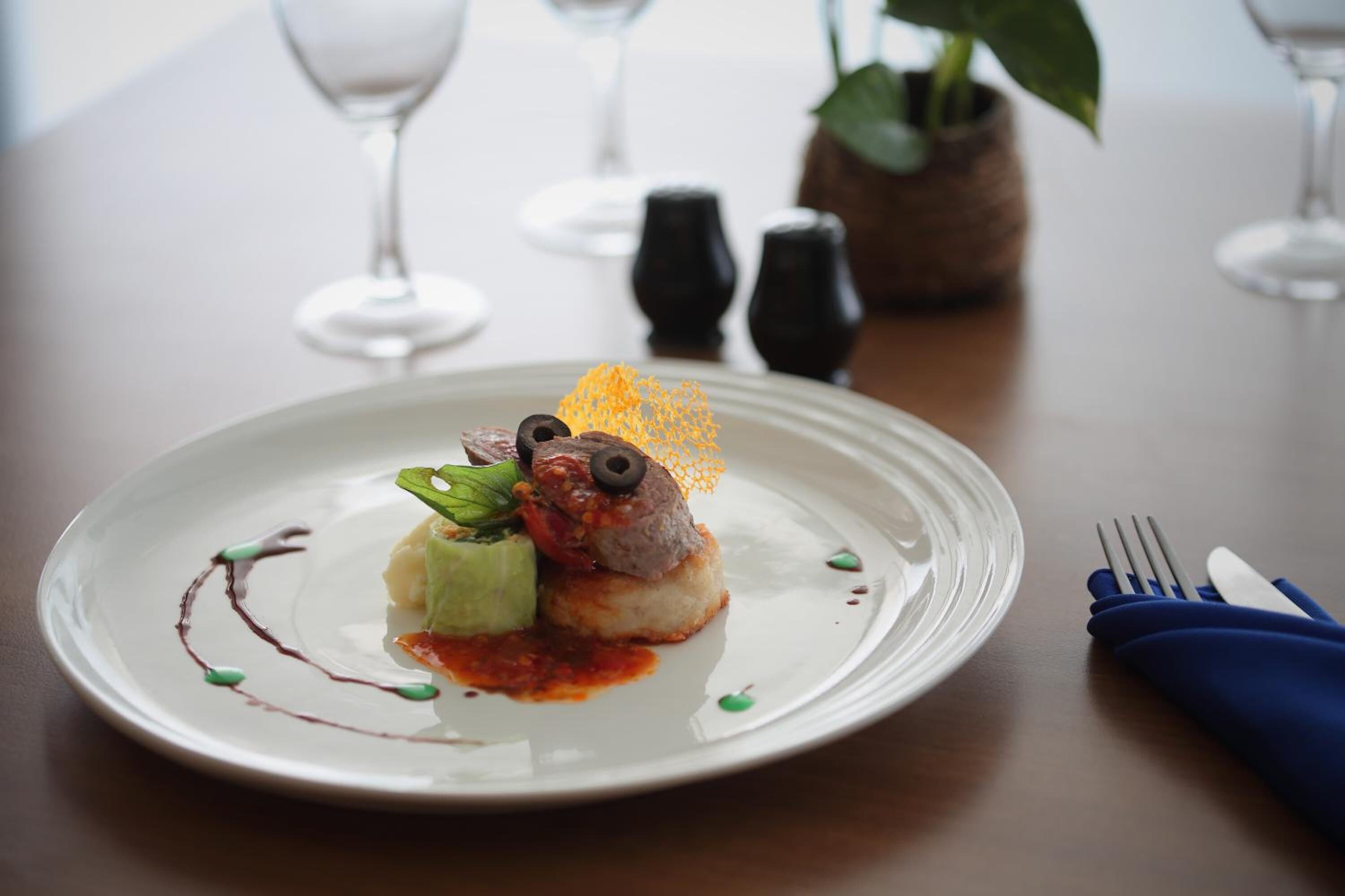 A white plate with a dessert on a table.