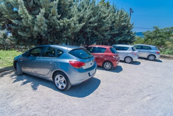 A parking lot with several cars parked.