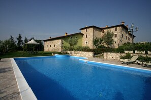 Seasonal outdoor pool, pool umbrellas, pool loungers