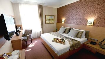 Standard Double Room, City View | Minibar, in-room safe, desk, iron/ironing board